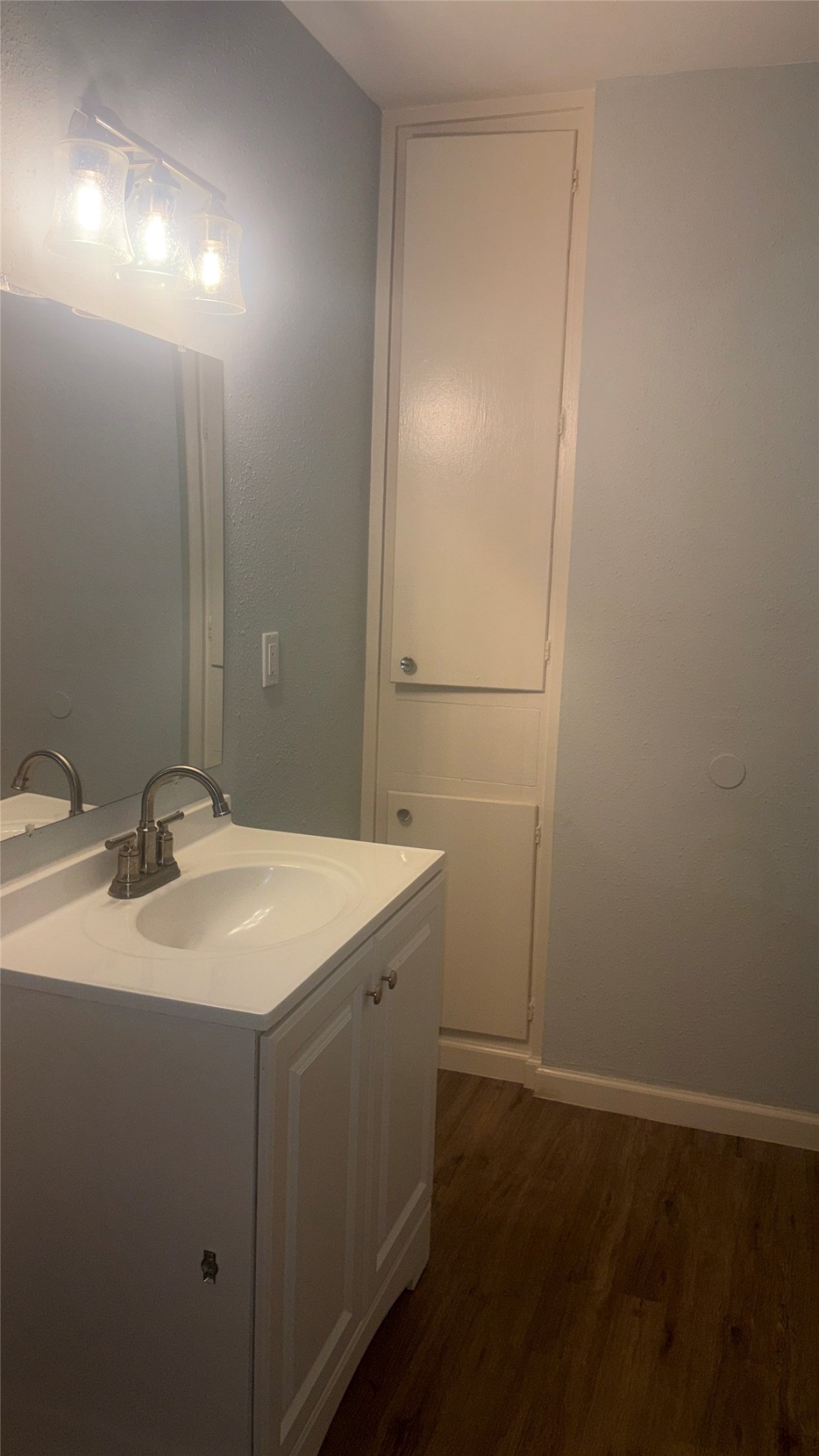 4624 Bell Street, Unit 2 Houston, TX 77023 - Photo 10 of 10 a bathroom with a sink and a mirror