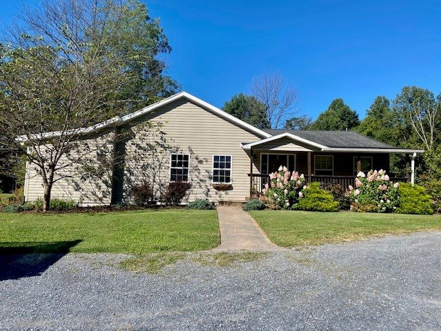 10585 Allman Road Dayton, VA 22821 - Photo 1 of 1 a front view of a house with yard and green space