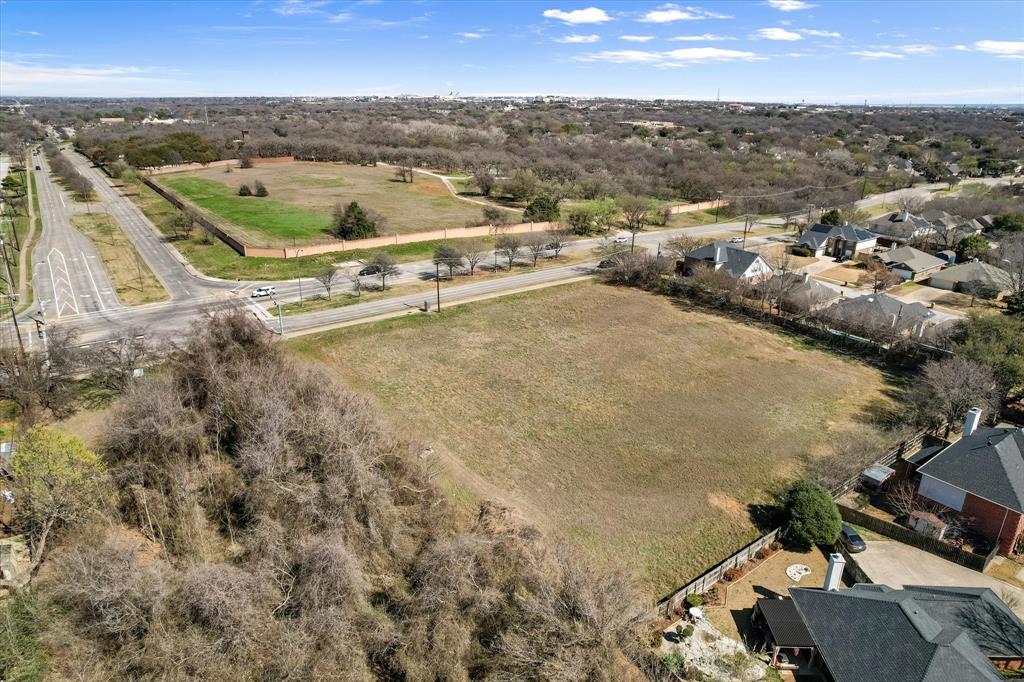 2400 West Sublett Road Arlington, TX 76001 - Photo 5 of 8 an aerial view of residential houses with outdoor space
