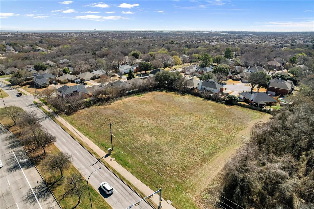 2400 West Sublett Road Arlington, TX 76001 - Photo 6 of 8 an aerial view of residential houses with outdoor space