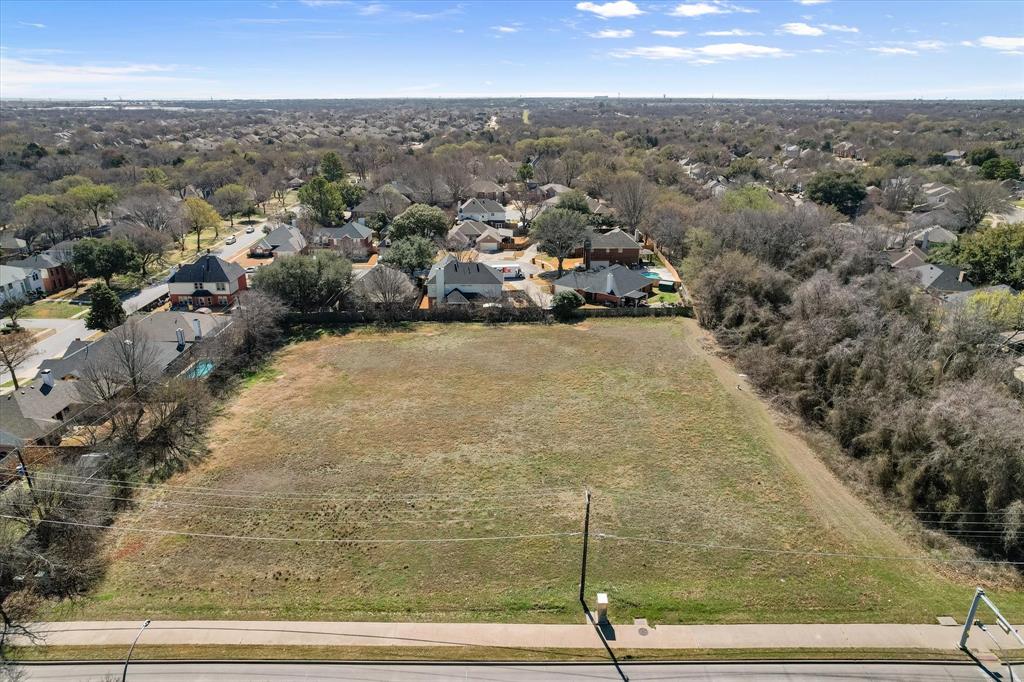 2400 West Sublett Road Arlington, TX 76001 - Photo 7 of 8 an aerial view of residential houses with outdoor space