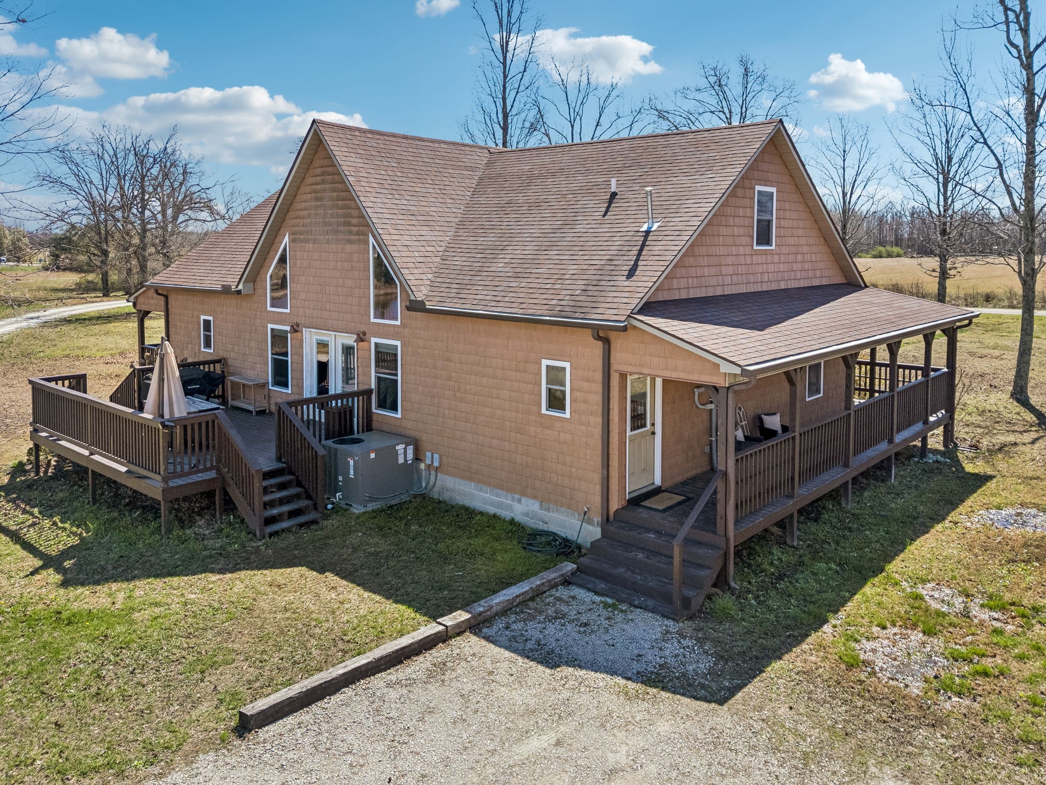 267 Switzerland Road Hohenwald, TN 38462 - Photo 88 of 98 a front view of a house with garden