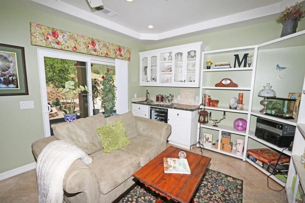 24568 Rutherford Road Ramona, CA 92065 - Photo 16 of 25 a living room filled with furniture and a window