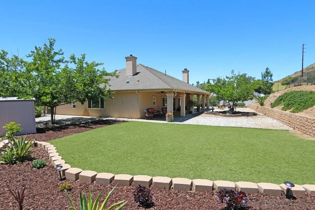 24568 Rutherford Road Ramona, CA 92065 - Photo 5 of 25 a front view of a house with garden