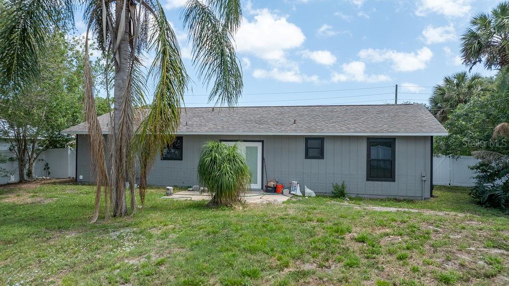 682 Degroodt Road Southwest Palm Bay, FL 32908 - Photo 27 of 27 a view of a house with a yard