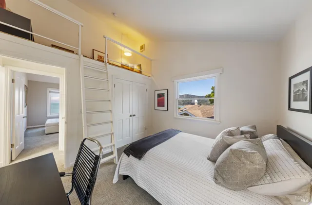 a bathroom with a granite countertop sink a toilet and a mirror