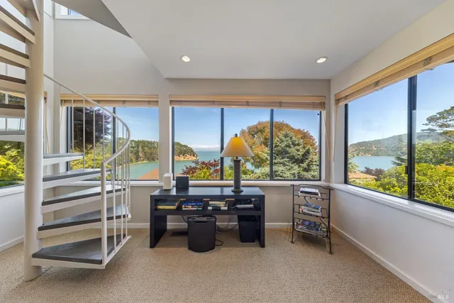 a view of workspace with furniture and window