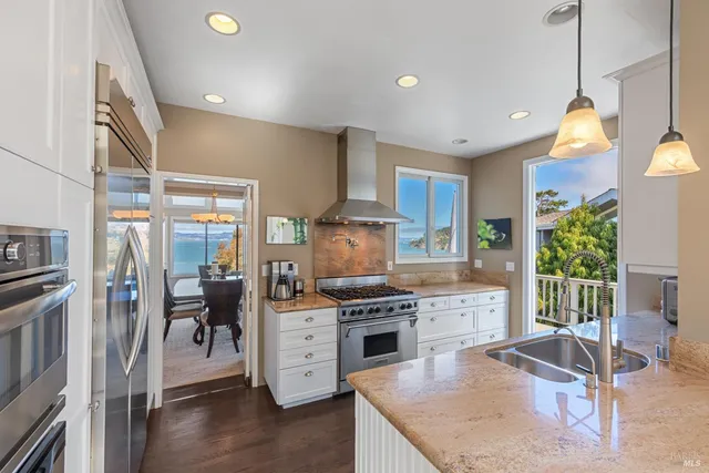 an aerial view of a house with a lake view