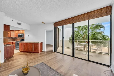 a view of a kitchen with wooden floor
