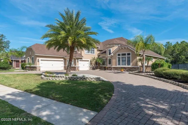 a living room with kitchen island furniture and a chandelier