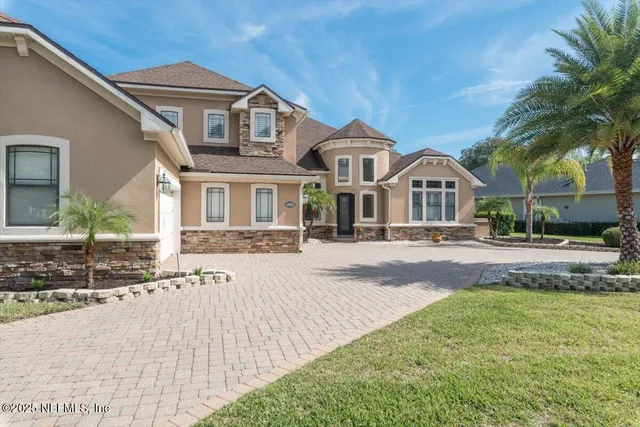 a bedroom with a bed a couch and dresser