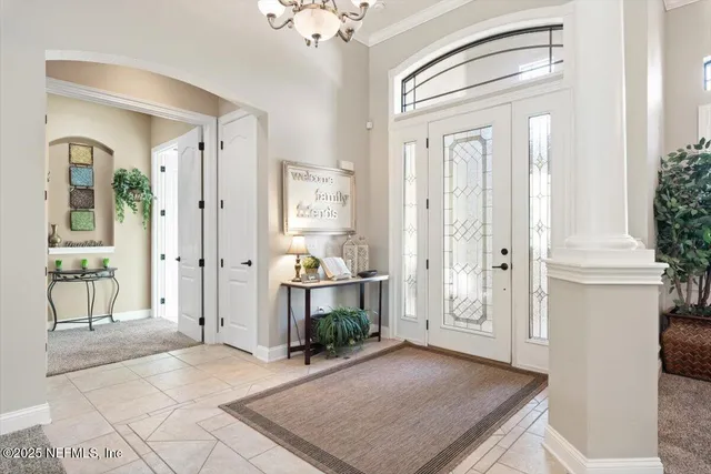a spacious bathroom with a double vanity sink large mirror and a bathtub
