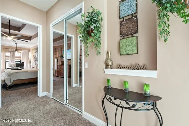 a view of a patio with table and chairs and potted plants