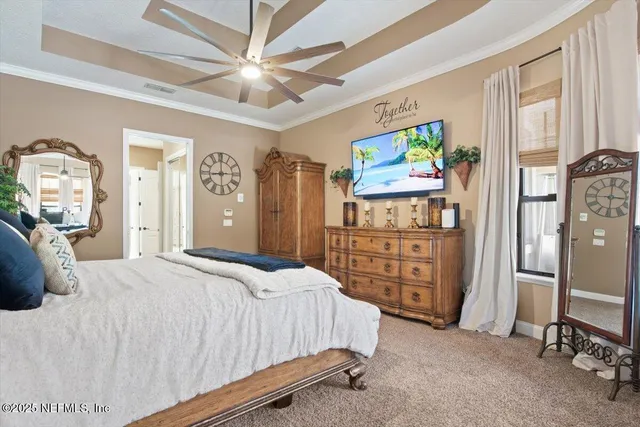 an aerial view of a house with outdoor space and a lake view