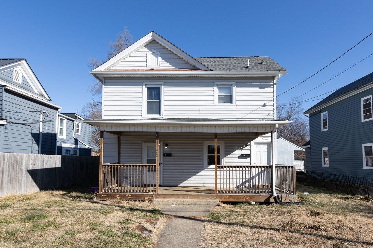 a front view of a house with garage