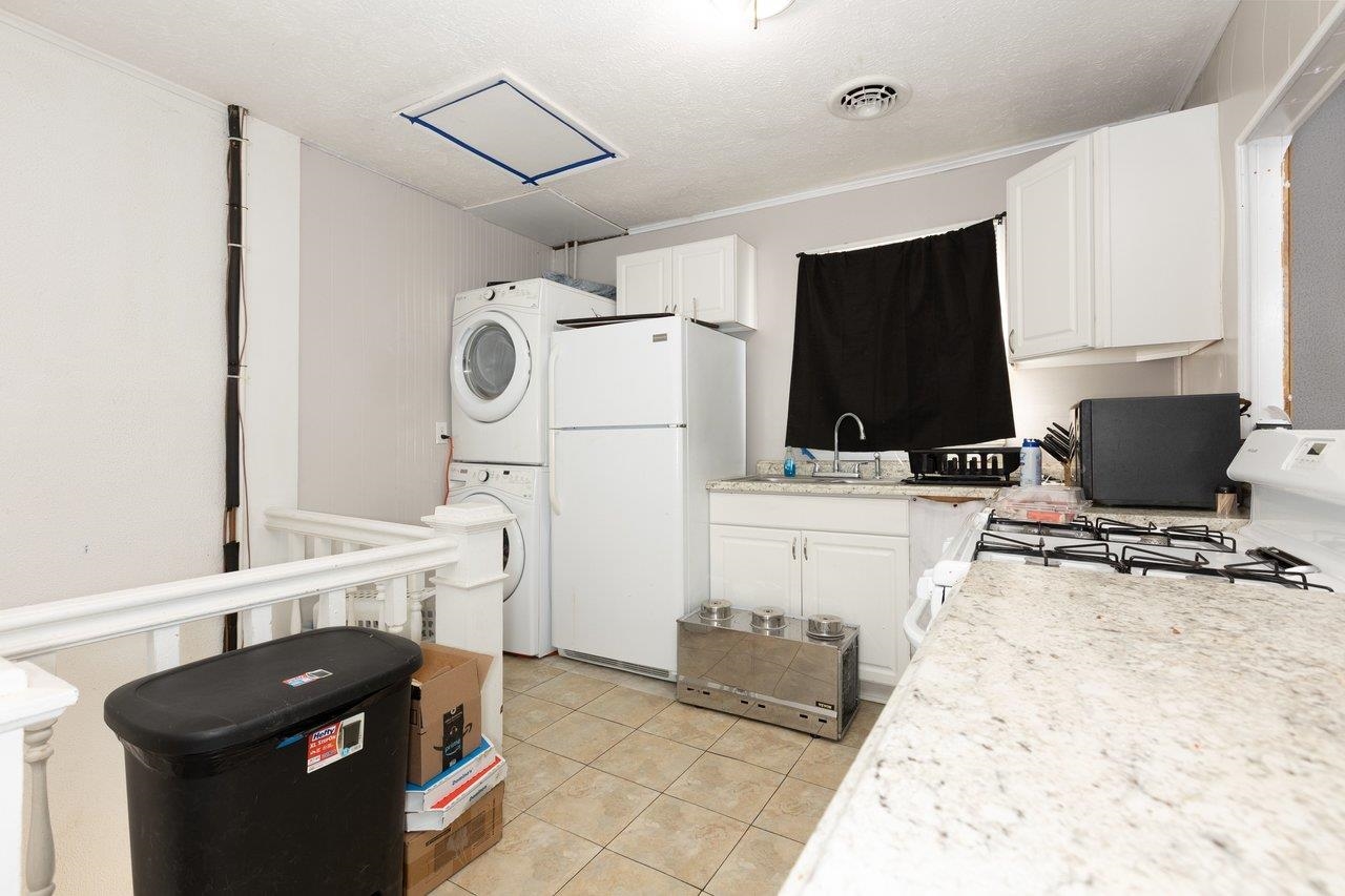 317 West 12th Street Waynesboro, VA 22980 - Photo 26 of 39 a kitchen with a sink and a stove top oven