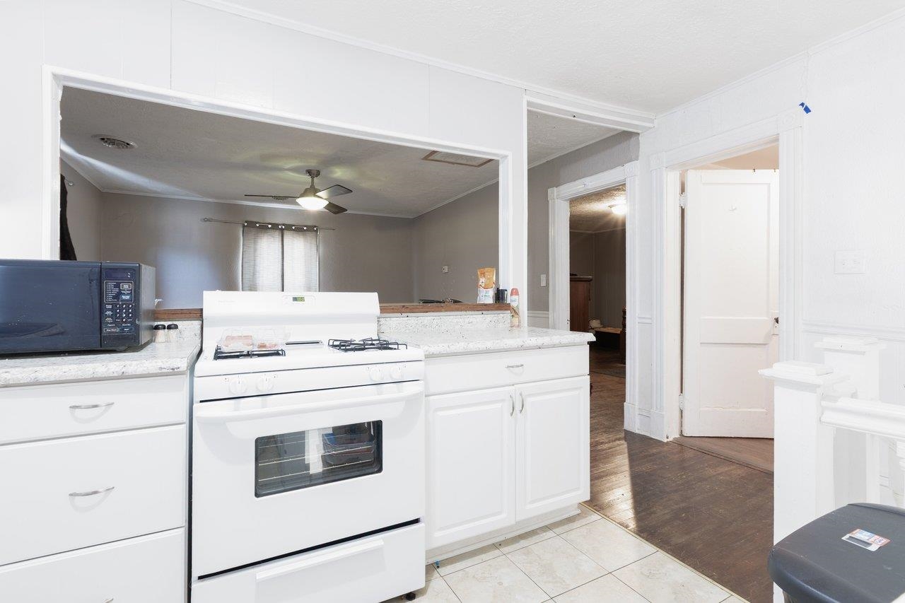 317 West 12th Street Waynesboro, VA 22980 - Photo 27 of 39 a kitchen with a stove and a refrigerator