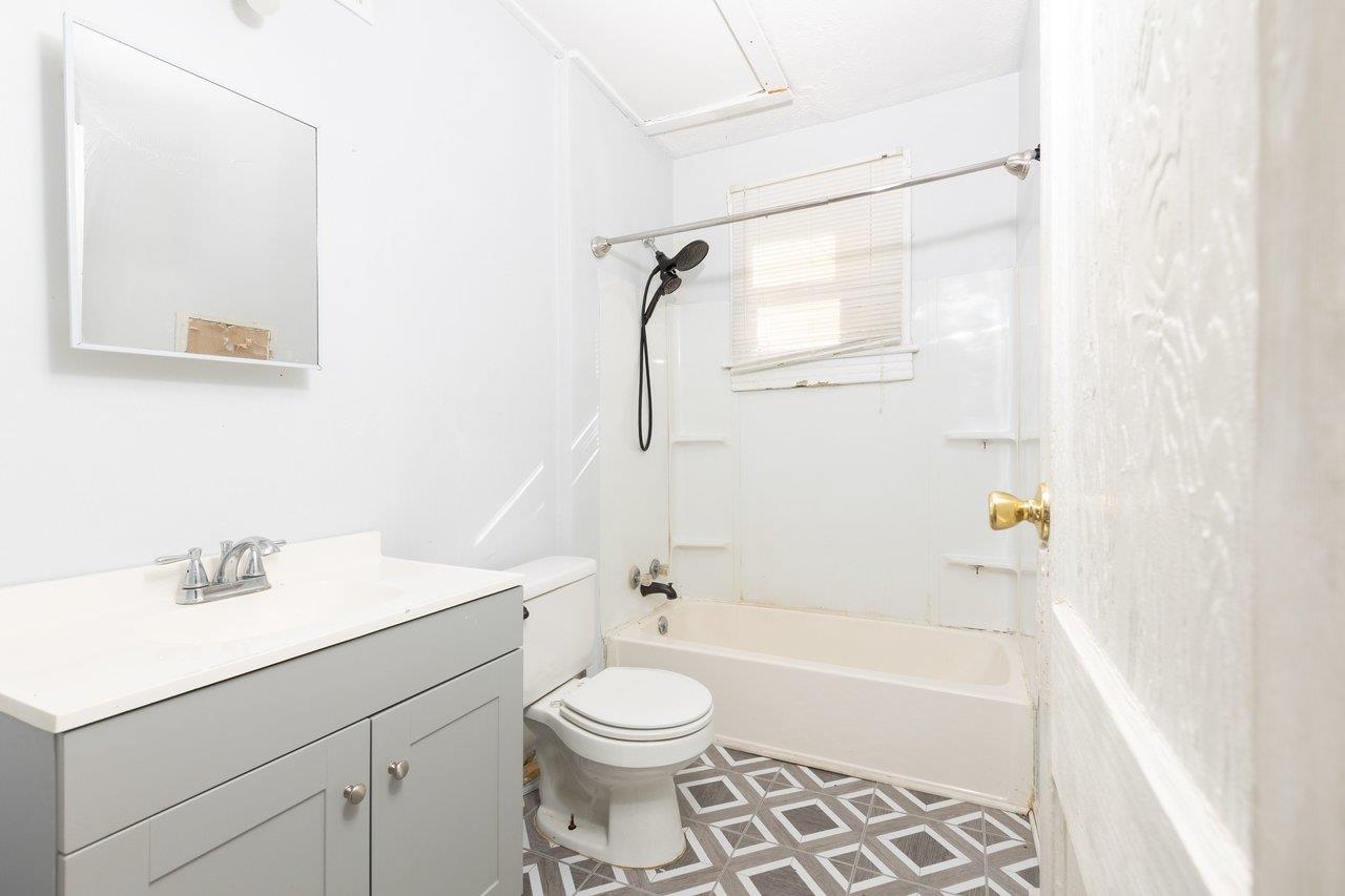317 West 12th Street Waynesboro, VA 22980 - Photo 8 of 39 a bathroom with a sink a toilet and shower