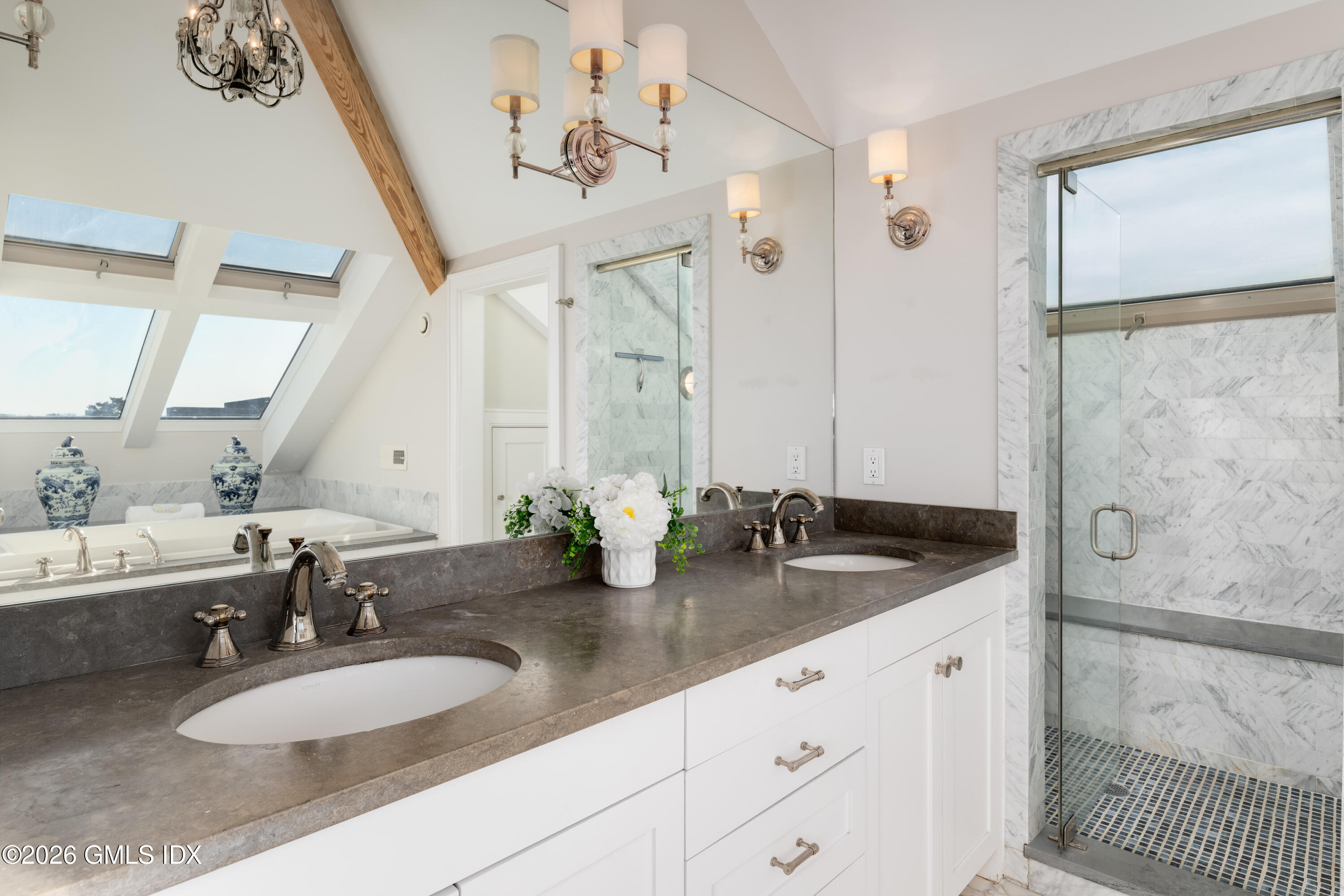 189 Shore Road Old Greenwich, CT 06870 - Photo 20 of 38 a bathroom with double sink and a mirror