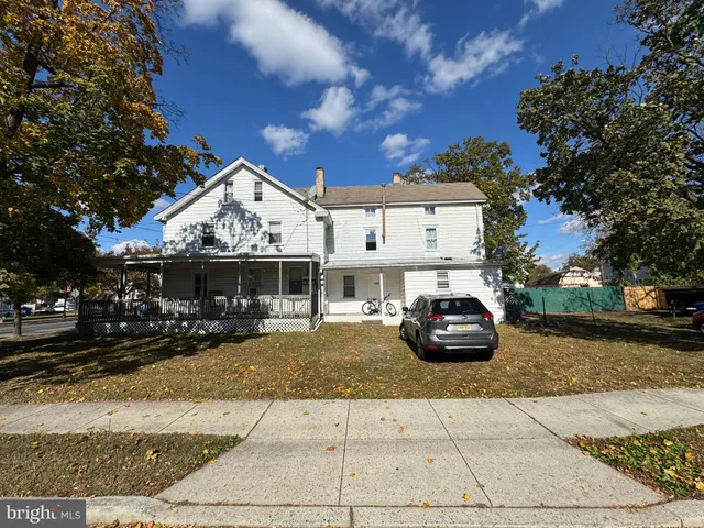 a car parked in front of a house