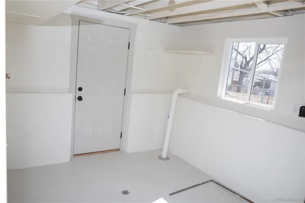 a view of room with window and hallway