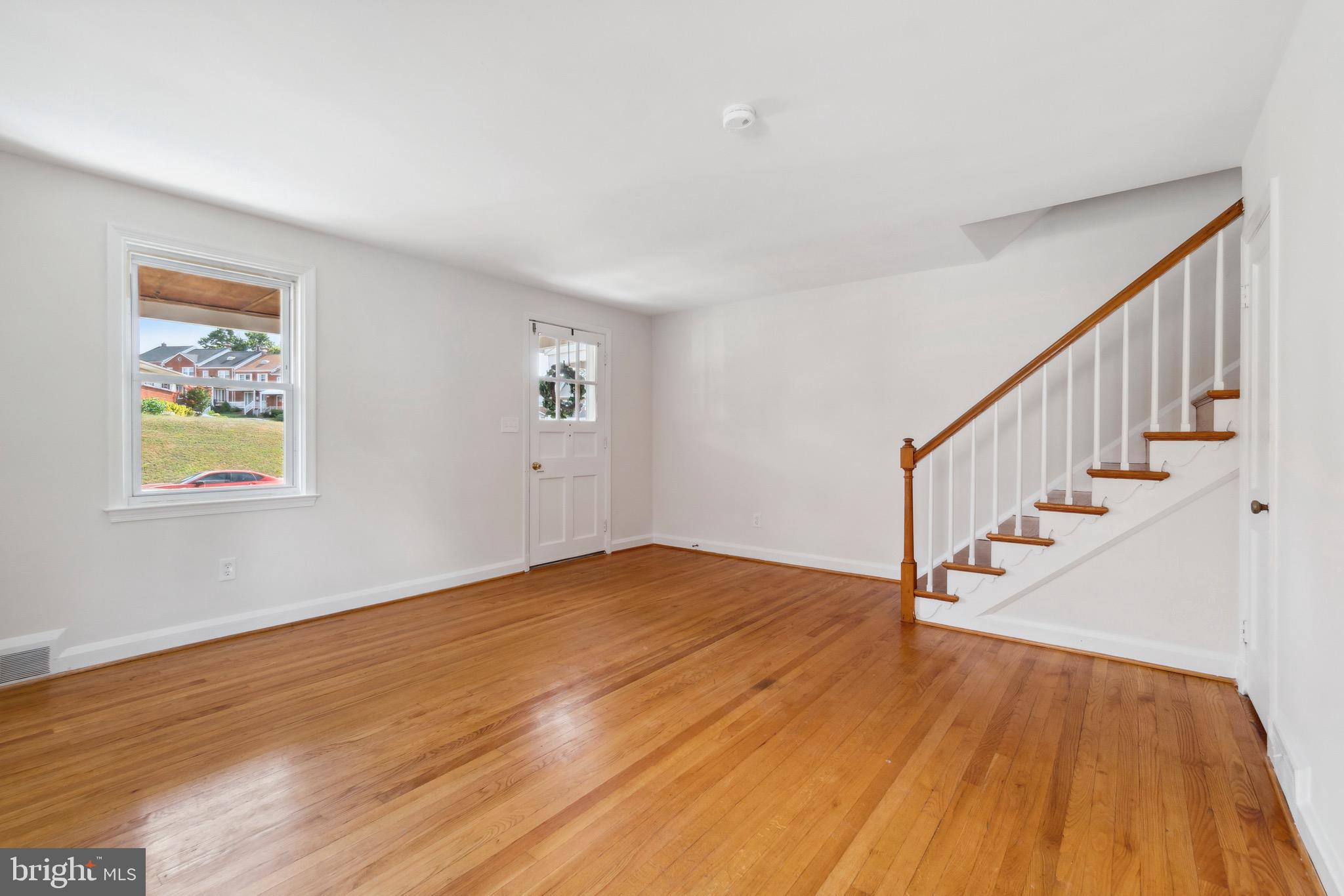 1010 Elm Road Halethorpe, MD 21227 - Photo 3 of 32 Living Room Entry w/ Beautiful Wood Floors