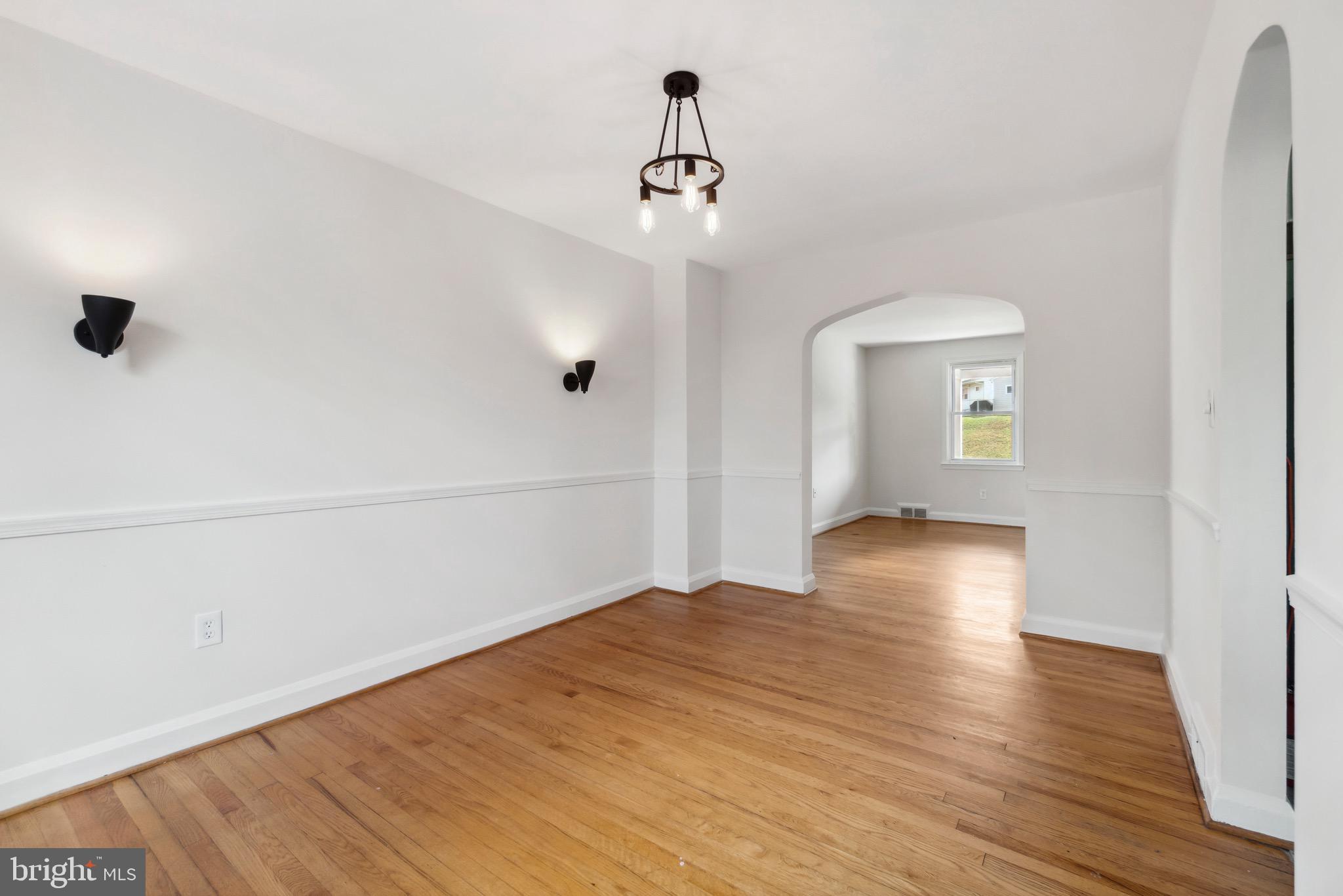 1010 Elm Road Halethorpe, MD 21227 - Photo 7 of 32 Dining Room w/ Chair Rail & Updated Lighting