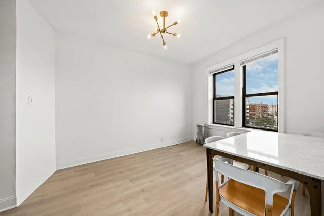 a view of room with a table and window