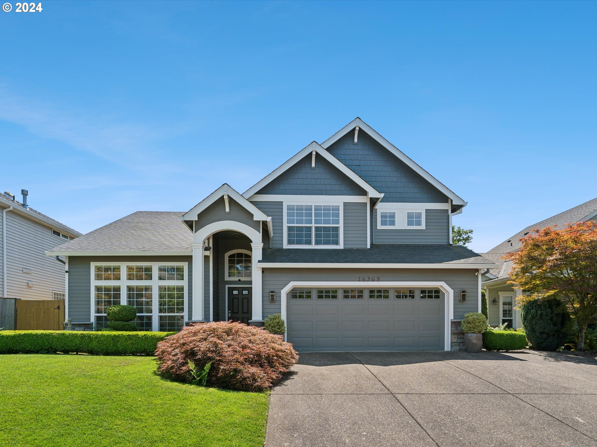 16368 Northwest Graf Street Portland, OR 97229 - Photo 11 of 46 a front view of a house with a garden and yard