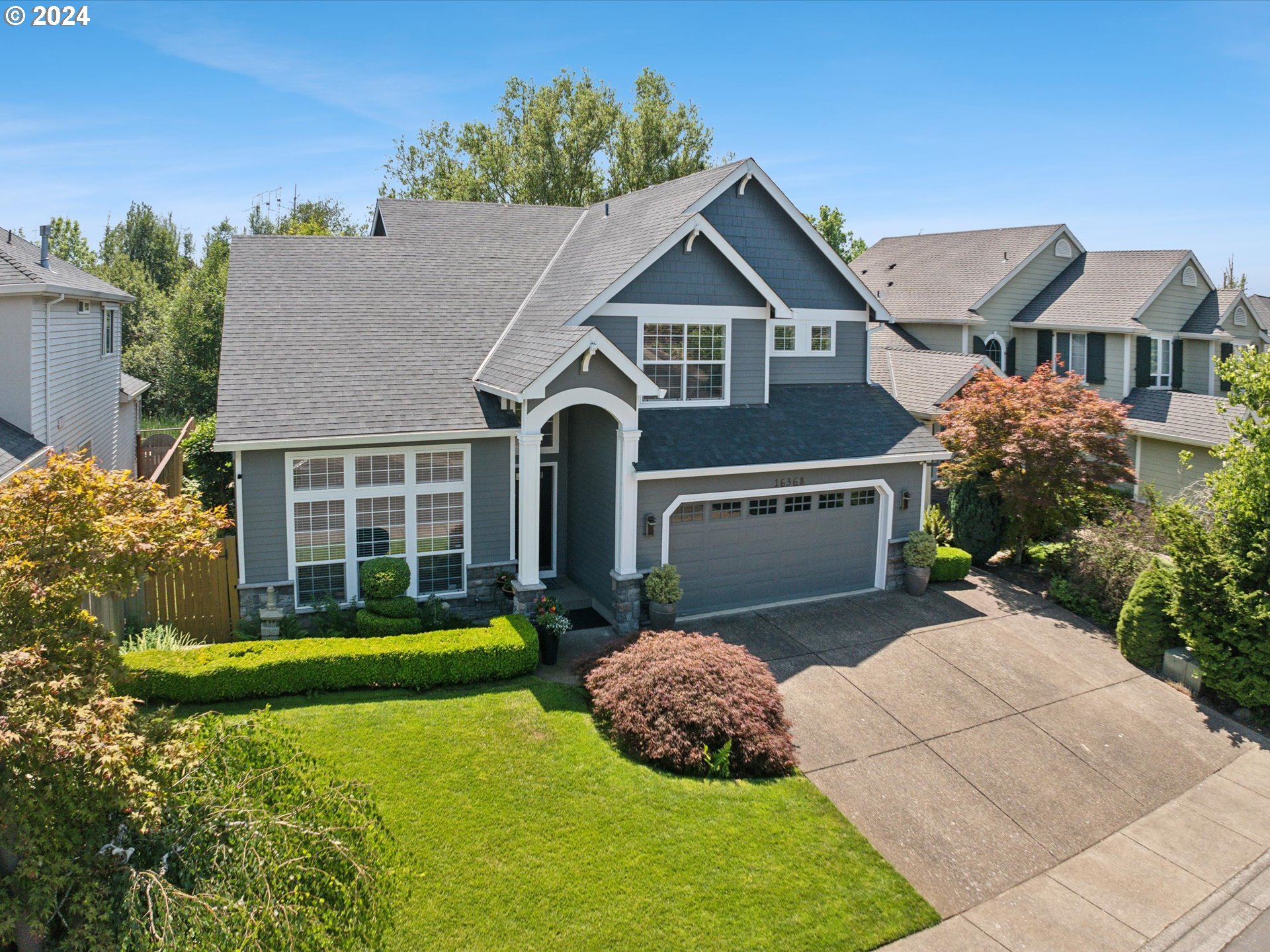 16368 Northwest Graf Street Portland, OR 97229 - Photo 13 of 46 a front view of a house with garden