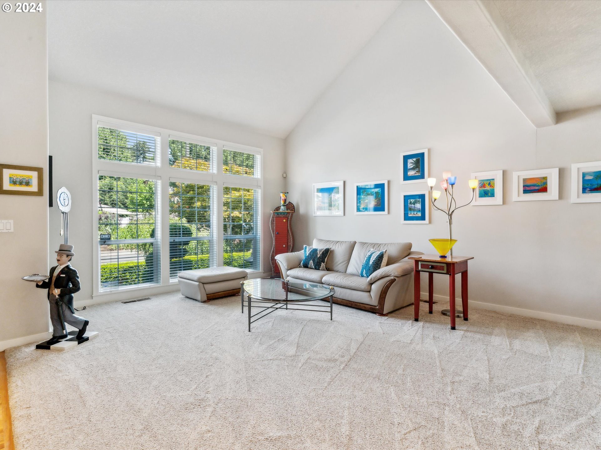 16368 Northwest Graf Street Portland, OR 97229 - Photo 16 of 46 a living room with furniture and a large window