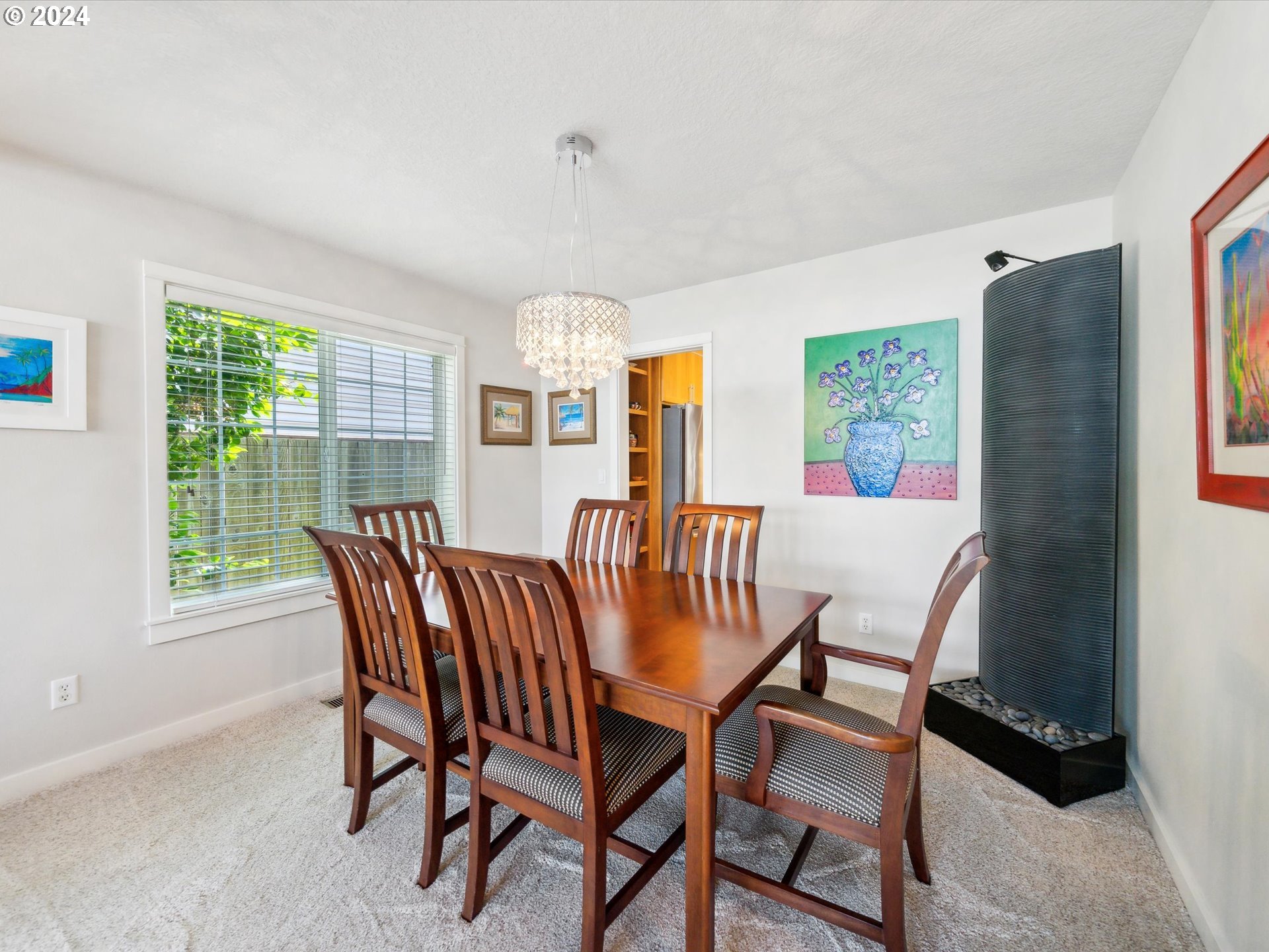 16368 Northwest Graf Street Portland, OR 97229 - Photo 18 of 46 a view of a dining room with furniture and a potted plant