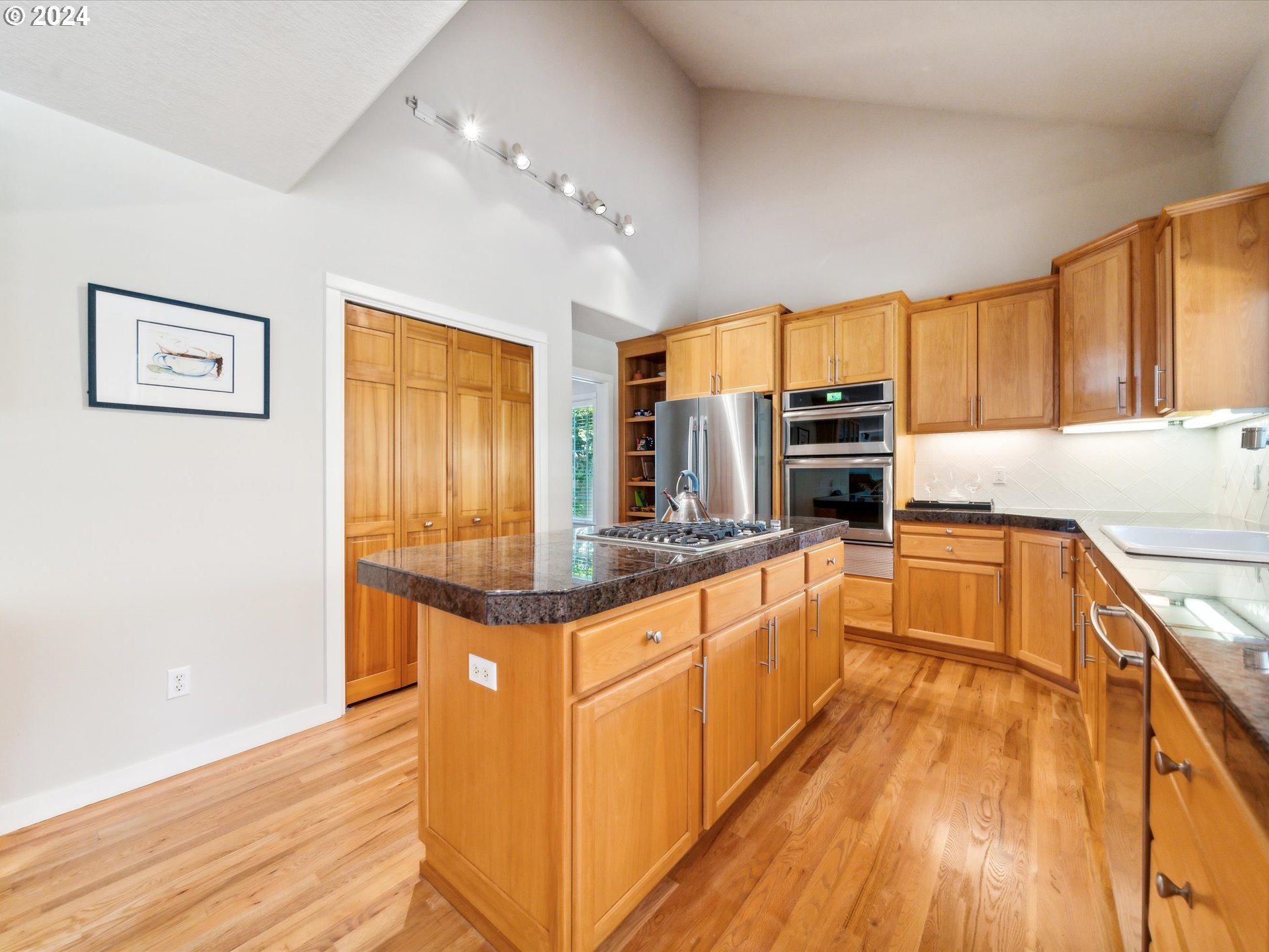 16368 Northwest Graf Street Portland, OR 97229 - Photo 21 of 46 a kitchen with stainless steel appliances granite countertop a sink and cabinets