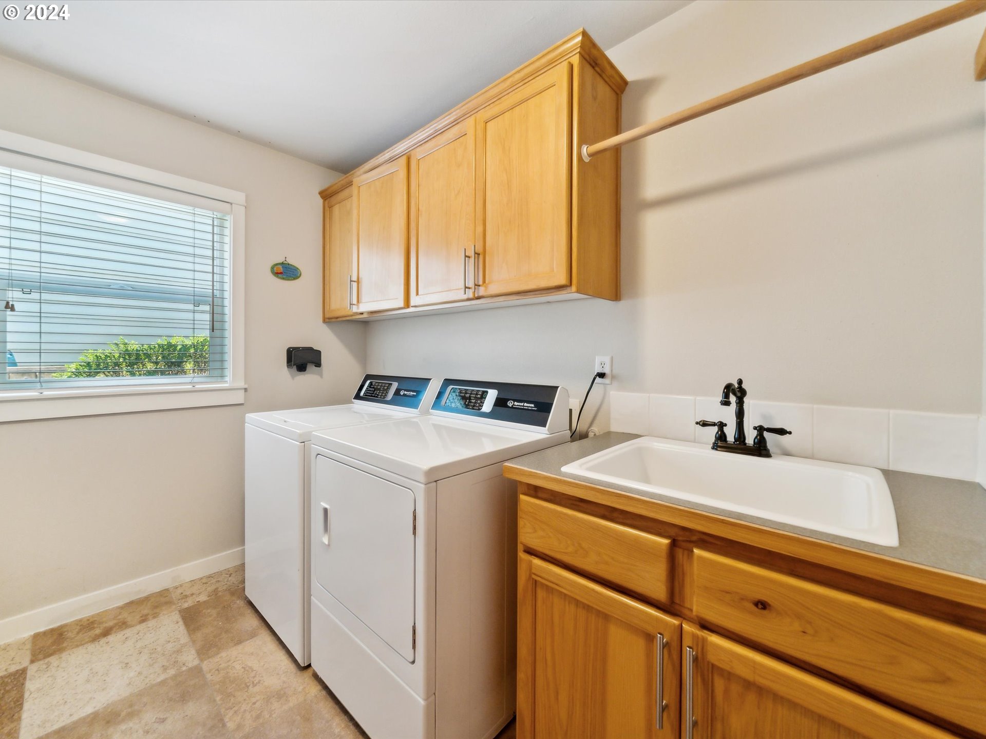 16368 Northwest Graf Street Portland, OR 97229 - Photo 27 of 46 a utility room with dryer and washer