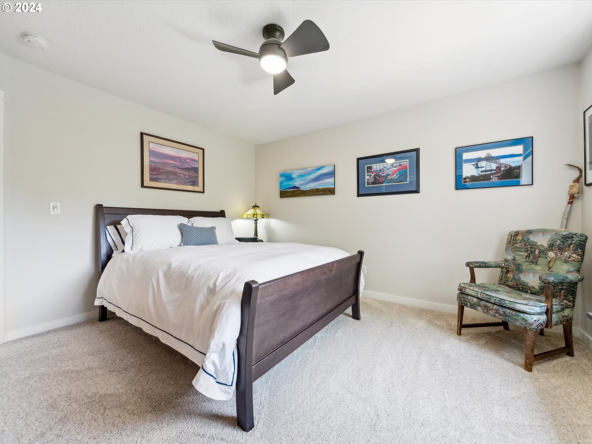 16368 Northwest Graf Street Portland, OR 97229 - Photo 32 of 46 a bedroom with a bed and a chair