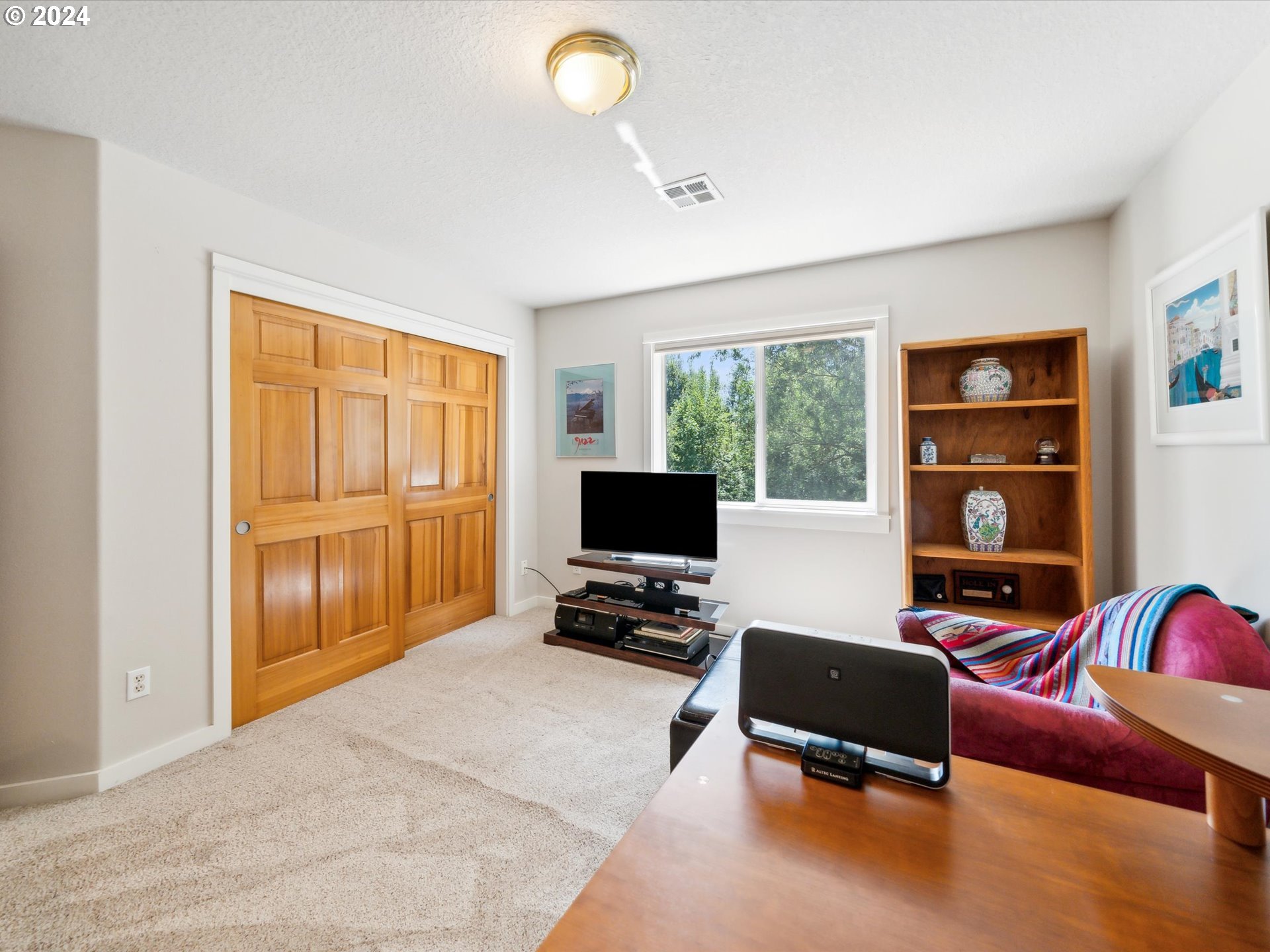 16368 Northwest Graf Street Portland, OR 97229 - Photo 35 of 46 a living room with furniture and a flat screen tv