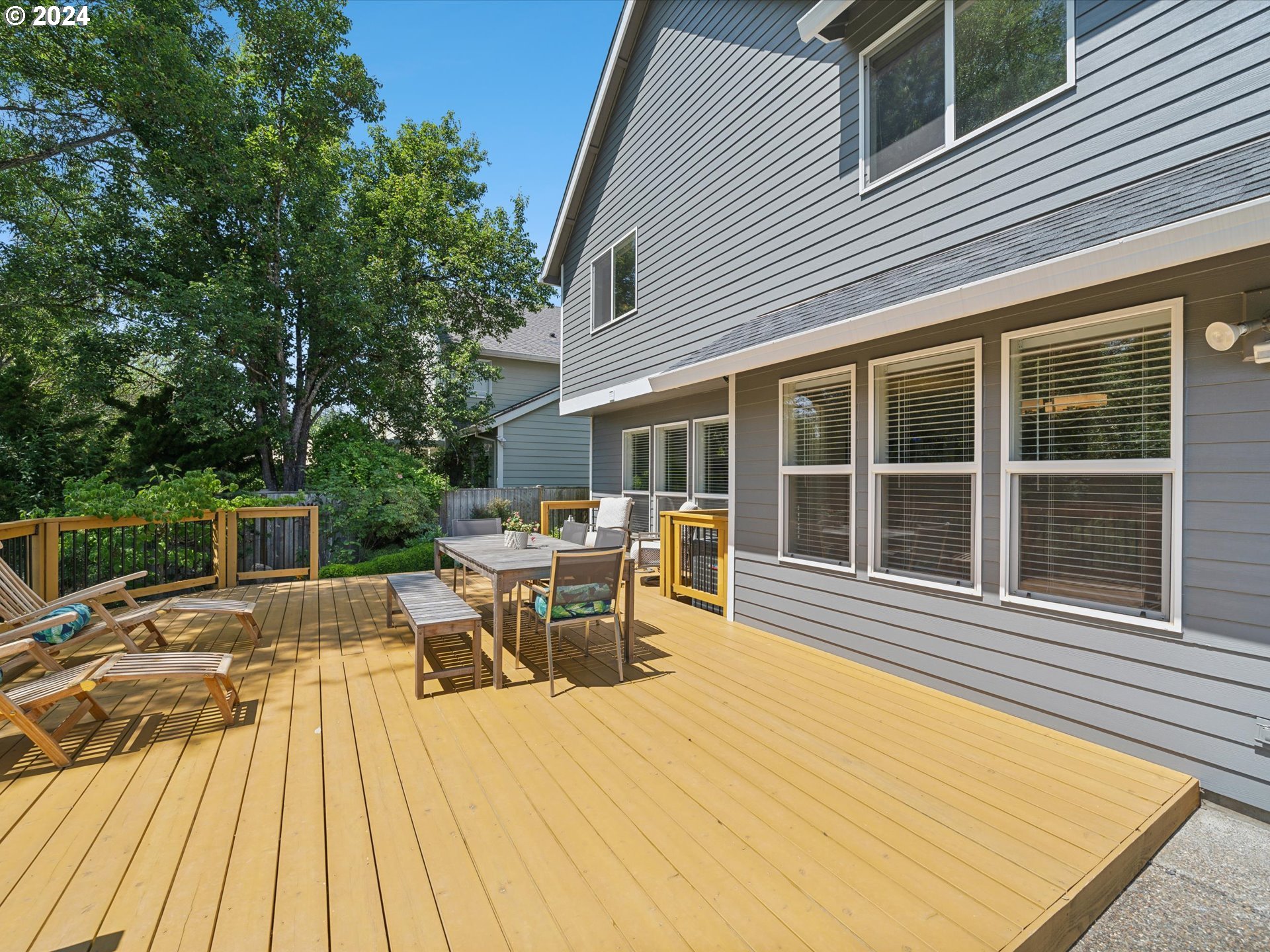 16368 Northwest Graf Street Portland, OR 97229 - Photo 40 of 46 a view of a patio with table and chairs wooden floor and fence