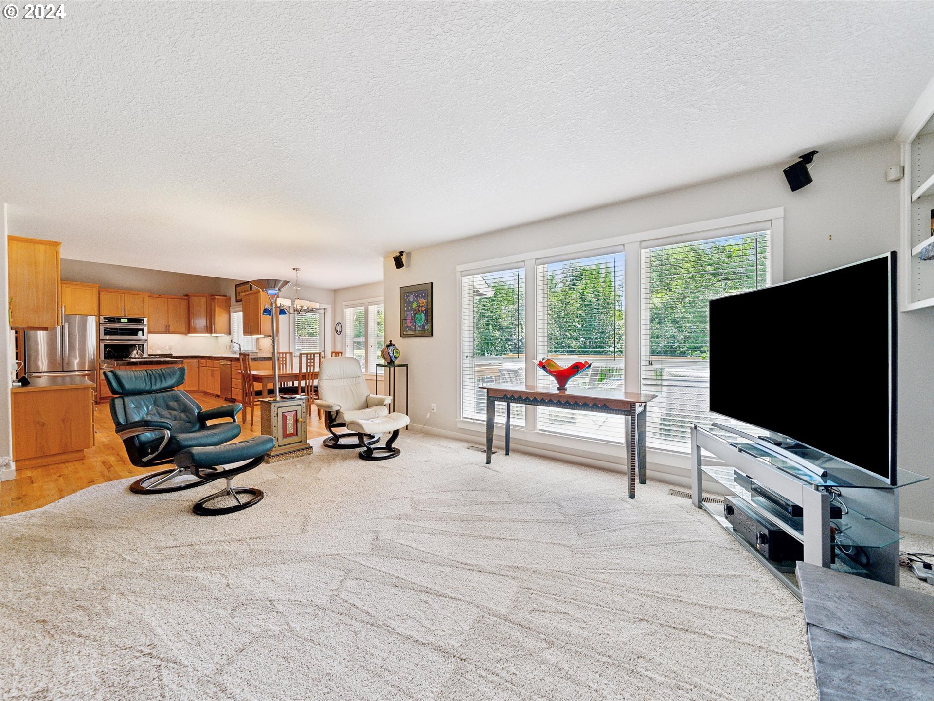 16368 Northwest Graf Street Portland, OR 97229 - Photo 5 of 46 a living room with furniture and a flat screen tv