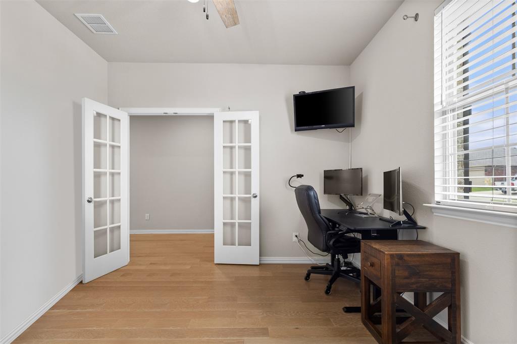 2304 Ravensway Road Crandall, TX 75114 - Photo 20 of 22 a view of a workspace with furniture and a window