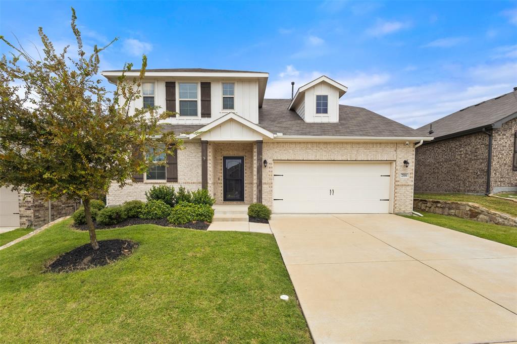 2304 Ravensway Road Crandall, TX 75114 - Photo 3 of 22 a front view of a house with yard and green space