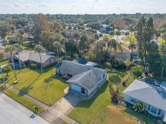 a view of a backyard with a patio