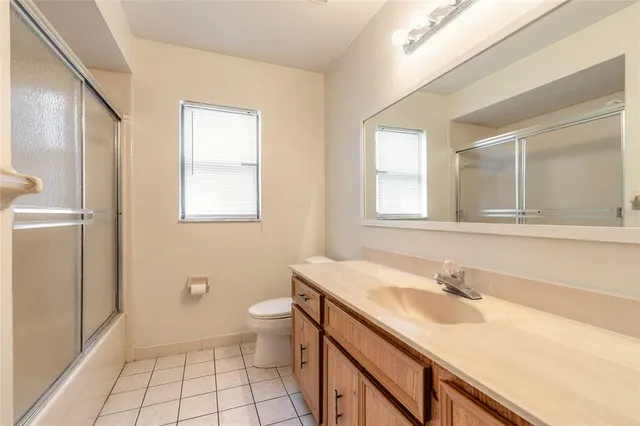 a bathroom with a sink toilet and vanity