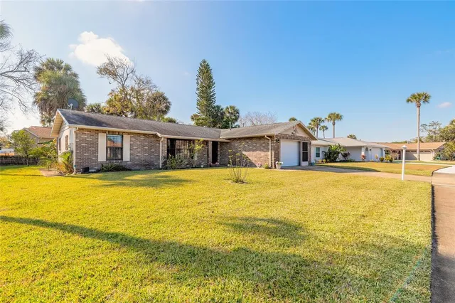 a house view with swimming pool in front of it