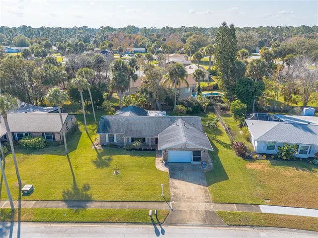 an aerial view of a house with swimming pool