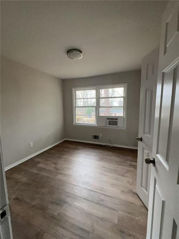 3109 Janice Circle Atlanta, GA 30341 - Photo 5 of 10 a view of an empty room with wooden floor and a window