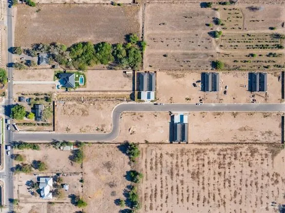 an aerial view of residential houses with outdoor space