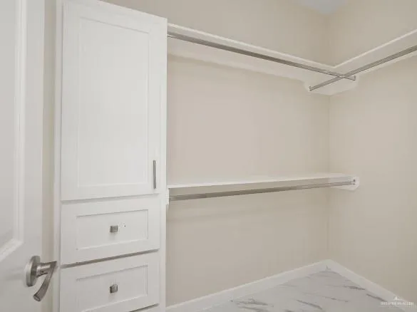 a view of an empty walk in closet