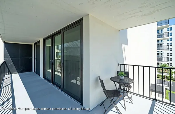 a view of a balcony and chairs