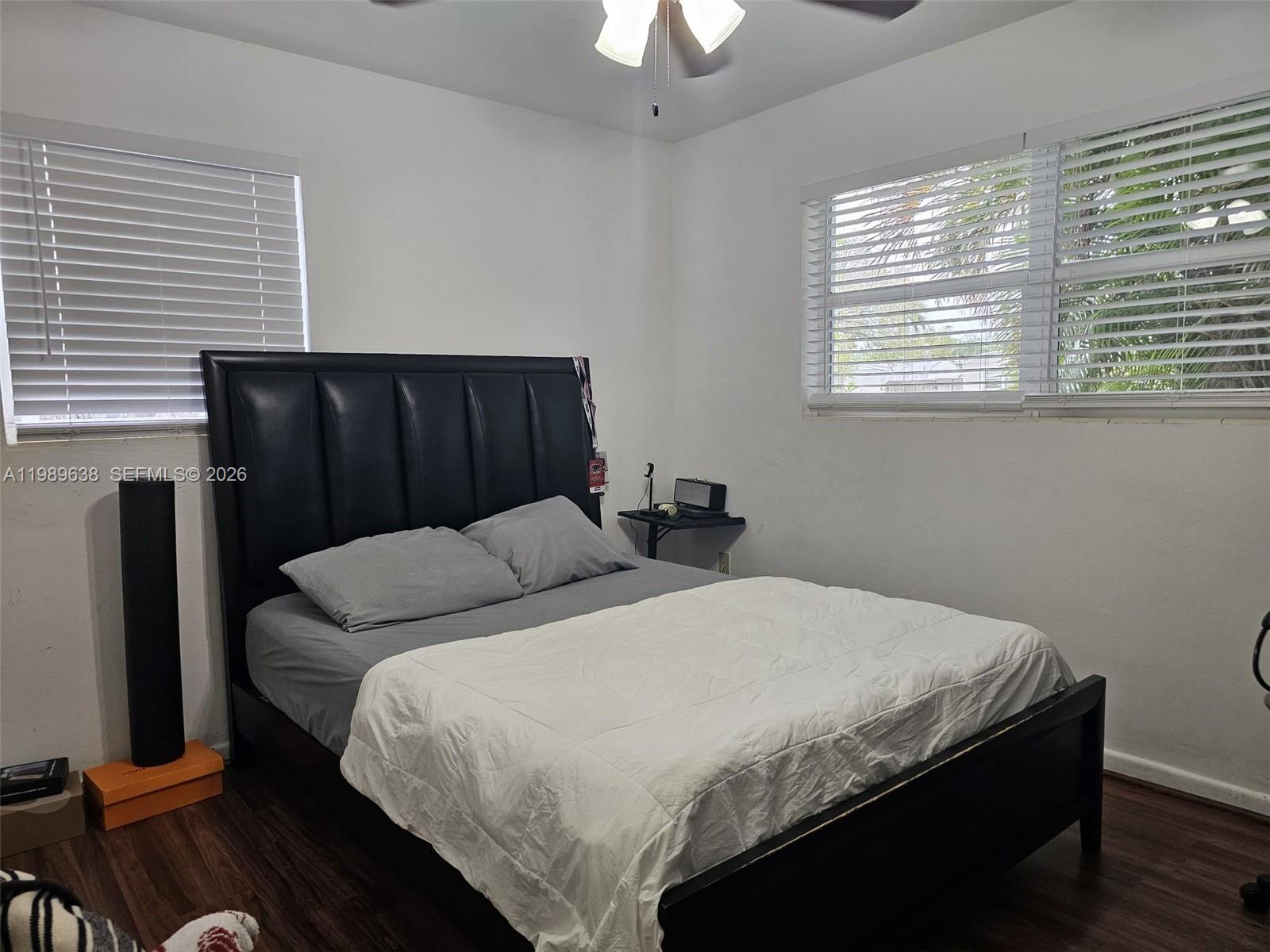 569 Tallulah Road Lake Worth, FL 33462 - Photo 14 of 40 a bedroom with a bed and a window
