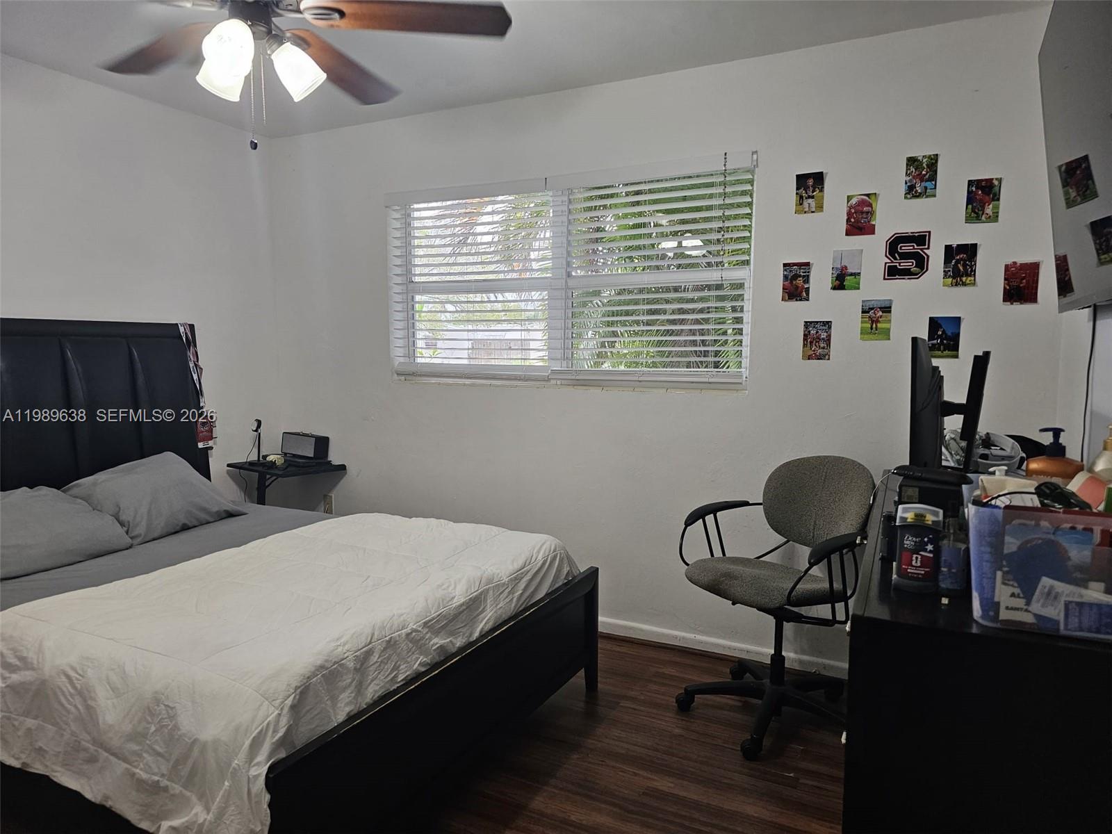 569 Tallulah Road Lake Worth, FL 33462 - Photo 16 of 40 a bedroom with a bed and a chair